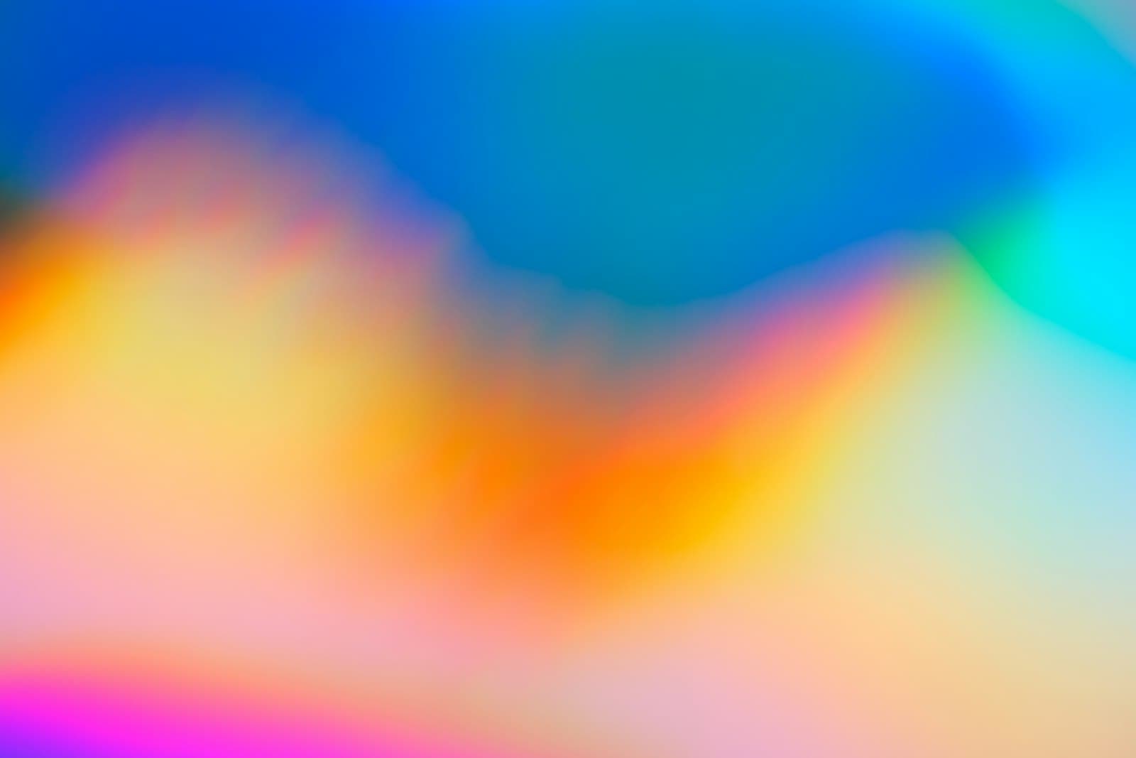 Soft abstract colour blur in orange, blue and pink
